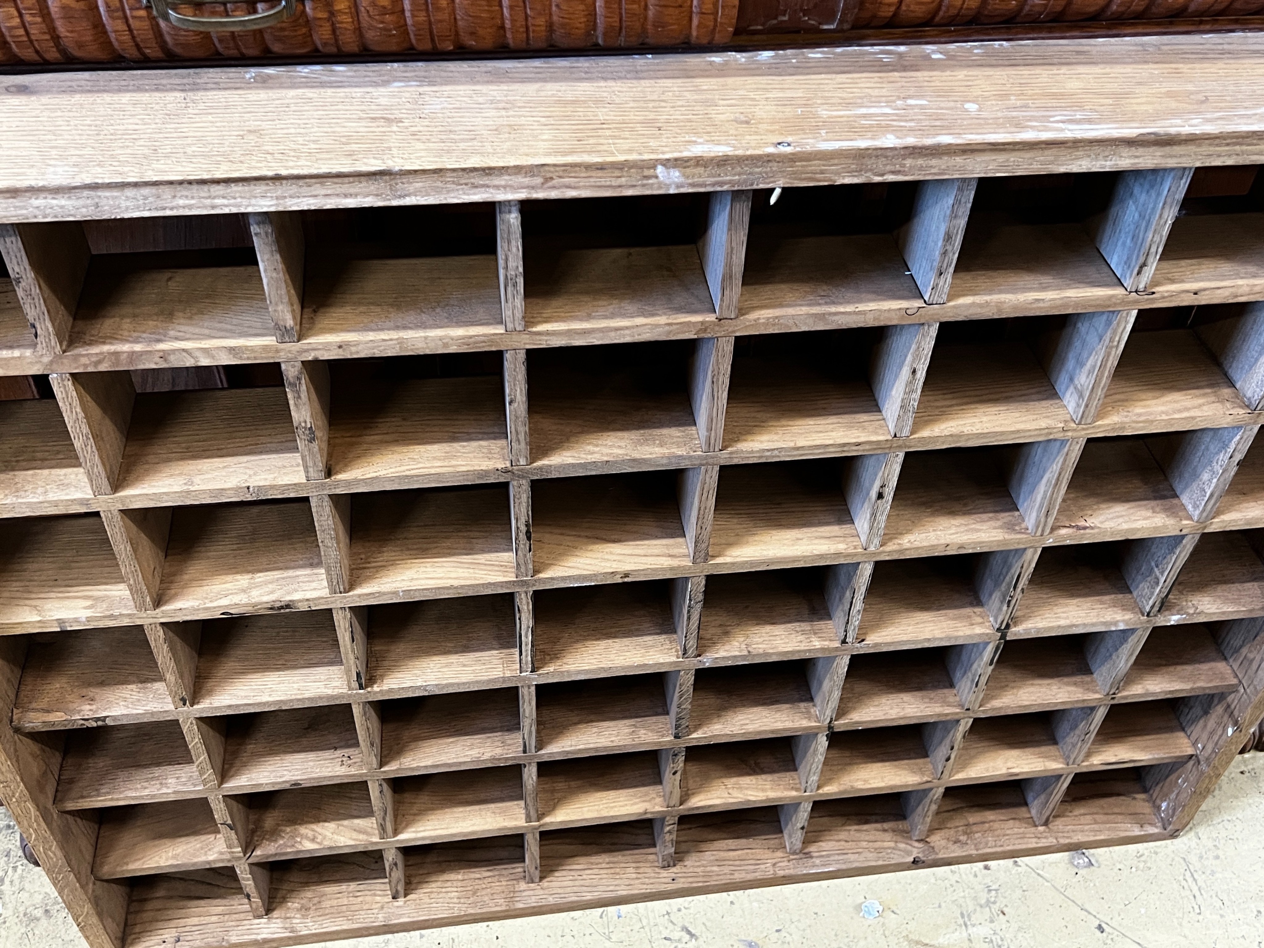 An oak pigeonhole unit, width 112cm, height 86cm together with a vintage four hook coat rack, width 86cm